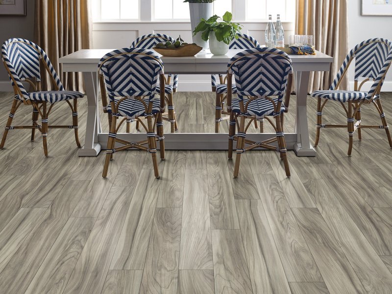 Dining room with wood-look laminate flooring from Novakoski Floor Covering in Anderson, IN