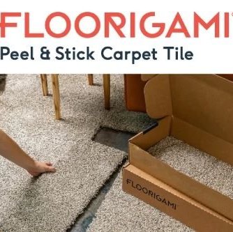 Person installing gray Floorigami carpet tiles from Novakoski Floor Covering in Anderson, IN